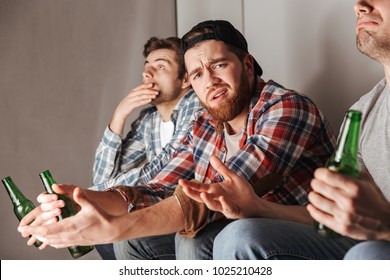 Photo Of Crushed Guys Expressing Frustration And Dissatisfaction While Watching Football Game In Flat With Bad Results