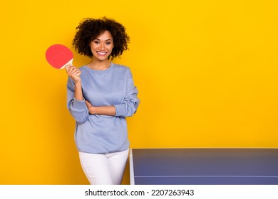 Photo of cute adorable curly girl dressed blue pullover ready playing table tennis isolated yellow color background