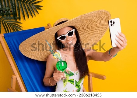 Photo of cute beautiful girl dressed bodysuit recording video vlog sitting lounge chair isolated yellow color background