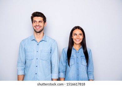 Photo Of Cute Cheerful Brown Haired Charming Couple Of Spouses Feeling Awkward Smiling Toothily Wearing Jeans Denim Isolated Over Grey Color Background