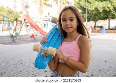 Photo Of Cute Child Girl With Skateboard Outdoors,