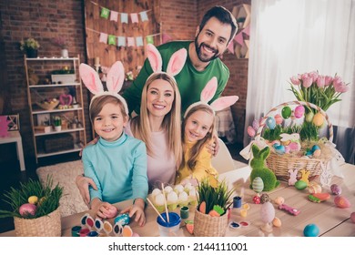 Photo of cute good mood family spend free time together make craft decorations spring easter holiday relaxing at home