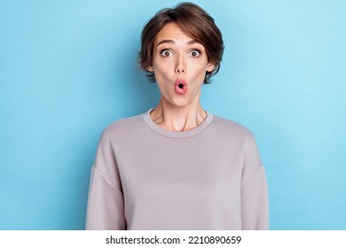 Photo Of Cute Gorgeous Pretty Girl Bob Hairstyle Gray Sweatshirt Staring At Unbelievable Sale Banner Isolated On Blue Color Background