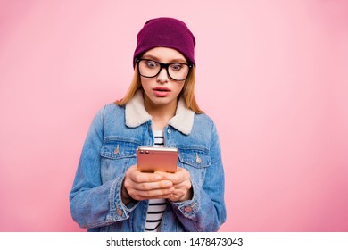 Photo Of Cute Horrified Girl Seeing Her Phone Screen Cracked While Isolated With Pink Background