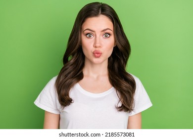 Photo of cute impressed young lady wear white t-shirt lips pouted isolated green color background