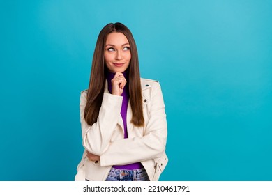 Photo Of Cute Lady Arm Touch Face Hmm Consider Interested Discount Make Choice Buy Clothes Empty Space Isolated On Blue Color Background