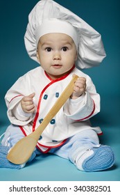 photo of cute little baby with chef hat