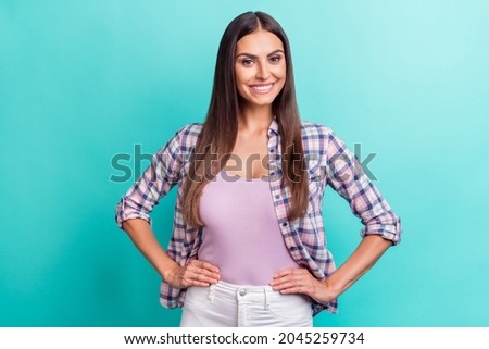 Photo of cute millennial brunette lady wear violet shirt isolated on aquamarine color background