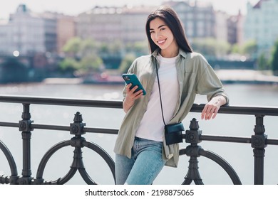 Photo Of Cute Pretty Girlfriend Wear Green Outfit Buying Clothes Modern Gadget Enjoying Sunny Weather Outdoors City Street