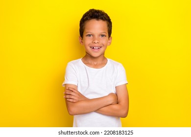 Photo of cute pretty preteen boy beaming smile wear stylish white clothes outfit arm crossed isolated on yellow color background - Powered by Shutterstock