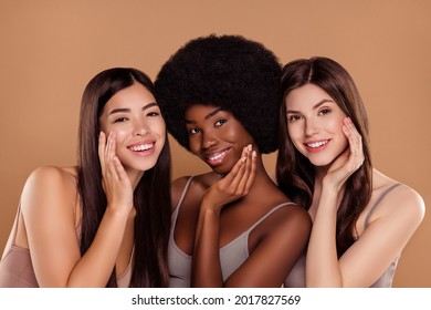 Photo of cute sweet three best friends wear cropped tops embracing arms cheeks smiling isolated beige color background - Shutterstock ID 2017827569