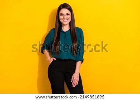 Photo of cute sweet woman wear green shirt spectacles empty space smiling isolated yellow color background