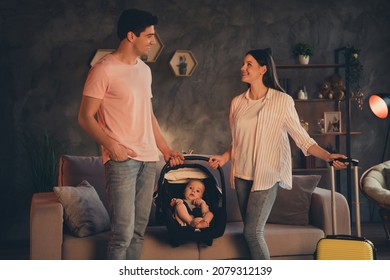 Photo of dad daddy mom mommy daughter kid in baby carrier hold baggage prepare family airport resort relax evening late indoors - Powered by Shutterstock