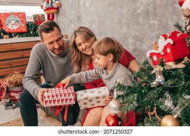 Photo Of Dad, Mom And Son. Spending Time. Christmas Tree At Home Has Happy Moments. Preparing For Holiday. Family With One Child. Happiness. Have Fun. Simple Living