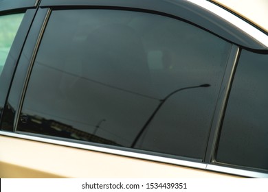 The photo of the darkened side glass on the gold car - Shutterstock ID 1534439351