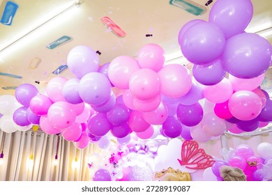 Photo of a decorative balloon setup in the ceiling for special occassion.