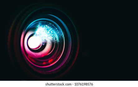 Photo Depicts Digital Projector Film Presentation. Projector Shiny Colorful Glass Lens Closeup, Macro View, Black Background.