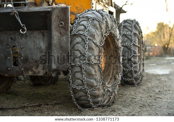 Photo\
detail with snow tire chains on big truck\
wheel