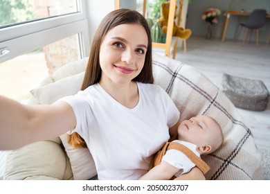 Photo Of Dream Nice Glad Mother Shoot Selfie Hold Embrace Infant Child Sleep Wear White T-shirt Home Indoors