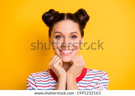 Photo of dreamy charming young girl dressed striped t-shirt arms chin smiling isolated yellow color background