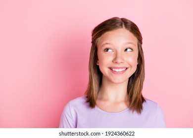 Photo Of Dreamy Cute Positive Little Girl Look Empty Space Wonder Smile Isolated On Pastel Pink Color Background