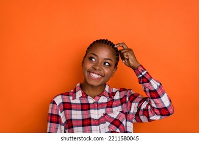 Photo Of Dreamy Funny Woman Dressed Plaid Shirt Looking Empty Space Forget Important Thing Isolated Shine Vibrant Orange Color Background