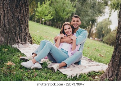 Photo Of Dreamy Sweet Boyfriend Girlfriend Wear Casual Outfits Sitting Grass Hugging Enjoying Sunny Weather Outdoors Garden