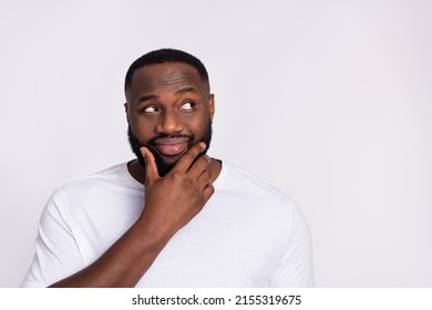 Photo of dreamy thoughtful guy dressed casual t-shirt arm chin looking empty space isolated white color background - Shutterstock ID 2155319675