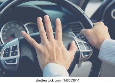 Photo of driver honking in traffic on the road - Shutterstock ID 348553844