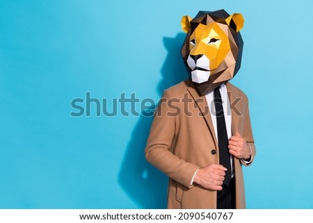 Photo of eccentric weird guy in lion mask look good virile empty space isolated over blue color background