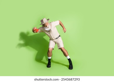 Photo of eco tourist senior man doing science exploring hold binoculars dancing isolated green color background - Powered by Shutterstock