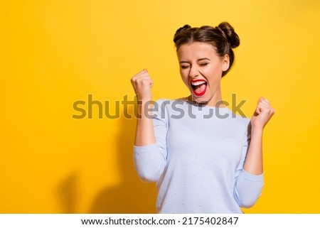 Photo of Photo of ecstatic lady shout loud yeah fist up raise win lottery isolated bright shine color background