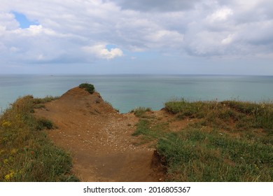 Photo Of The Edge Of A Cliff To The Sea