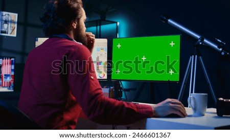 Photo editor using mockup PC monitor to color correct photographs in creative media agency. Photographer selecting best pictures for editorial content with isolated screen computer display