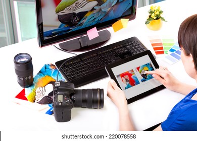 Photo editor working on computer and used graphics tablet. - Powered by Shutterstock