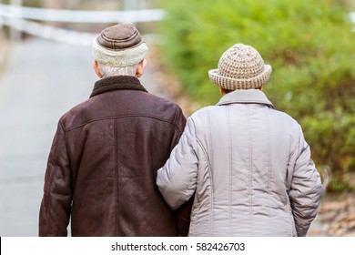 Photo Of Elderly Couple Walking In The Park