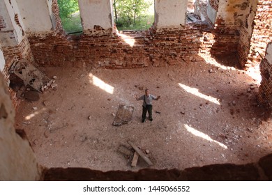 Photo Of An Elderly Man Over 65 In The Ruins Of An Ancient Church

