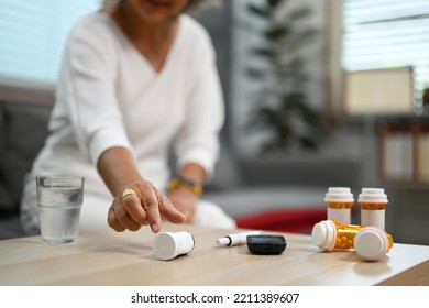 Photo Of Elderly Woman Taking Daily Medicine. Elderly Healthcare, Pharmaceutical Concept