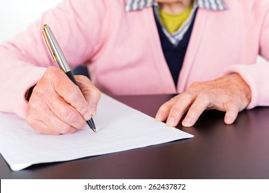 Photo Of Elderly Woman Who Is Writing A Letter