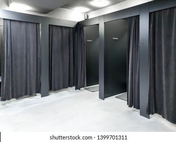 Photo of empty dressing room in clothes store