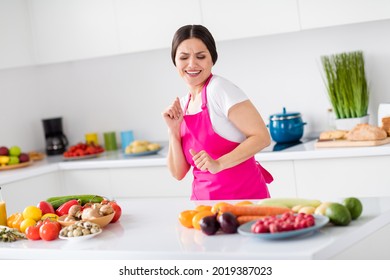 Photo Of Excited Brunette Hair Young Lady Dance Home Wear White T-shirt Apron At Kitchen