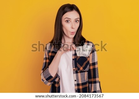 Photo of excited crazy lady cash money dollars pocket omg face isolated yellow color background