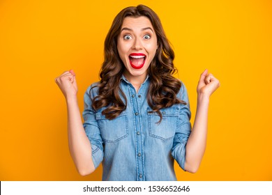 Photo of excited crazy sweet pretty cheerful gorgeous girl rejoicing with having wom jackpot with hairstyle curly wavy brunette isolated over vivid color background