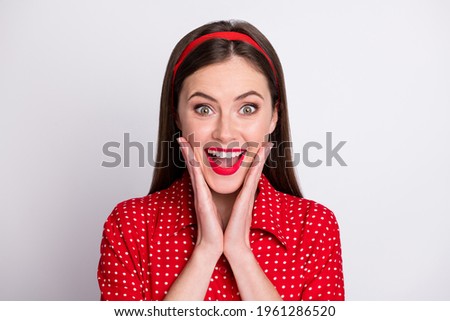 Photo of excited dreamy girl open mouth hands cheeks wear red dotted vintage blouse isolated grey color background