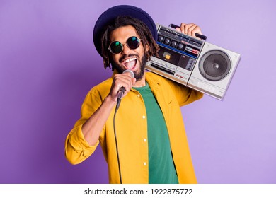 Photo Of Excited Funky Gut Hold Boom Box Mic Singing Enjoy Free Time Isolated On Magenta Color Background