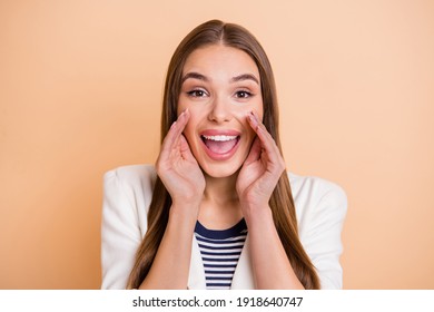 Photo Of Excited Girl Arms Open Mouth Look Camera Wear White Blazer Isolated Pastel Beige Color Background