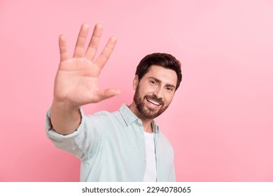 Photo of excited laughing young businessman have fun welcome wave palm high five hello friendly symbol isolated on pink color background - Powered by Shutterstock