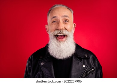 Photo Of Excited Shocked Funny Old Man Omg Reaction Open Mouth Wear Leather Jacket Isolated On Red Color Background