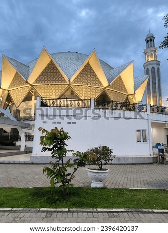 a photo exploration of the building and architecture of the Serdang Bedagai grand Mosque at sunset 