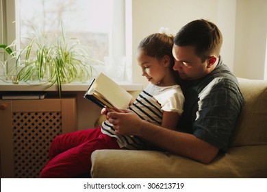 photo of father with daughter at home